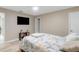 This bedroom features a tv, a small stand, and a comfortable bed with a Paris-themed comforter at 1406 Valley Pl, Brandon, FL 33510