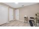 This bedroom features three white doors and wood-look floors at 1406 Valley Pl, Brandon, FL 33510