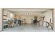 Organized two-car garage with shelving, laundry area, utility equipment, and a concrete floor at 1406 Valley Pl, Brandon, FL 33510