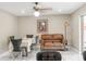 Cozy living room featuring a leather couch, dining table set, and marble floors at 1406 Valley Pl, Brandon, FL 33510