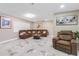 Spacious living room with comfortable seating, neutral tones, and abundant natural light at 1406 Valley Pl, Brandon, FL 33510