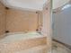Bathroom features a mosaic tile surround around the bath and glass shower at 14103 Stonebrook Ct, Tampa, FL 33624
