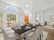 Formal dining room with large window providing natural light and backyard views at 14103 Stonebrook Ct, Tampa, FL 33624