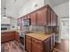 Well-equipped kitchen with granite countertops, a tile backsplash, and stainless steel appliances at 14103 Stonebrook Ct, Tampa, FL 33624