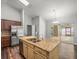 Kitchen island with a stainless steel sink, granite countertops and stainless steel appliances at 14103 Stonebrook Ct, Tampa, FL 33624