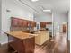 Spacious kitchen featuring granite countertops, dark wood cabinetry, and modern appliances at 14103 Stonebrook Ct, Tampa, FL 33624