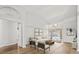 Bright and open living room with neutral furnishings and access to the pool area at 14103 Stonebrook Ct, Tampa, FL 33624