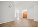Bright living room with hardwood floors and double doors to exterior at 14103 Stonebrook Ct, Tampa, FL 33624