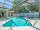 Sparkling screened-in pool and spa perfect for relaxing or entertaining at 14103 Stonebrook Ct, Tampa, FL 33624