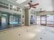 Bright sunroom featuring ceiling fans, and sliding glass doors leading to the outside at 14103 Stonebrook Ct, Tampa, FL 33624