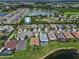 Aerial view of the homes in the neighborhood surrounding a large lake at 1517 Yale Castle Ct, Ruskin, FL 33570