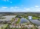 Beautiful aerial view of a waterfront residential community with lush landscaping and stunning water views at 1517 Yale Castle Ct, Ruskin, FL 33570