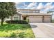 Charming two-story home with a three car garage, stone accents and well-manicured lawn at 1524 Rhodeswell Ln, Dover, FL 33527