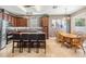 Gourmet kitchen with granite countertops, center island with seating, and stainless steel appliances at 1524 Rhodeswell Ln, Dover, FL 33527