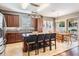 Gourmet kitchen with granite countertops, center island with seating, and stainless steel appliances at 1524 Rhodeswell Ln, Dover, FL 33527