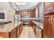 Kitchen with granite countertops, stainless steel appliances and ample storage at 1524 Rhodeswell Ln, Dover, FL 33527