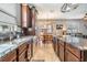 Open kitchen featuring granite countertops, stainless steel appliances and a seamless flow into the dining area at 1524 Rhodeswell Ln, Dover, FL 33527