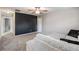 Cozy living room featuring neutral carpet, accent wall, ceiling fan, and ample natural light at 1524 Rhodeswell Ln, Dover, FL 33527