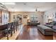 Spacious living space with hardwood flooring, ceiling fan and access to dining area at 1524 Rhodeswell Ln, Dover, FL 33527