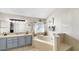A luxurious main bathroom with dual vanity, soaking tub, and updated lighting fixtures at 16928 Hawkridge Rd, Lithia, FL 33547