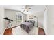 Comfortable bedroom with a ceiling fan, window, area rug, and a closet for a tidy space at 16928 Hawkridge Rd, Lithia, FL 33547