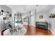 Bright dining room with hardwood floors, a piano, and views to the backyard at 16928 Hawkridge Rd, Lithia, FL 33547