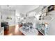 Open-concept dining room with hardwood floors, bright lighting, and access to other rooms at 16928 Hawkridge Rd, Lithia, FL 33547