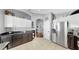 A beautiful kitchen with granite countertops, white cabinets and stainless-steel appliances at 16928 Hawkridge Rd, Lithia, FL 33547