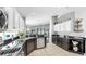 Lovely kitchen with granite counters, stainless appliances, and white and dark wood cabinets at 16928 Hawkridge Rd, Lithia, FL 33547