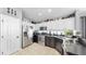 Charming kitchen features stainless appliances, granite countertops, and a tiled floor at 16928 Hawkridge Rd, Lithia, FL 33547