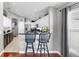 Kitchen boasts granite counters, stainless appliances, and counter-height bar with stylish stools at 16928 Hawkridge Rd, Lithia, FL 33547