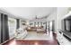 Spacious living room with vaulted ceilings and hardwood floors offers a bright open floorplan at 16928 Hawkridge Rd, Lithia, FL 33547