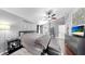 A main bedroom with a king bed, neutral color palette, and a modern ensuite bathroom at 16928 Hawkridge Rd, Lithia, FL 33547