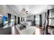 A main bedroom featuring a king bed, and direct access to the backyard and pool at 16928 Hawkridge Rd, Lithia, FL 33547