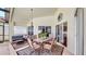 Covered patio with dining and seating area and sliding doors to the interior at 16928 Hawkridge Rd, Lithia, FL 33547