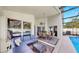 Screened in pool with patio seating, dining, and lush backyard landscaping at 16928 Hawkridge Rd, Lithia, FL 33547