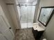 Modern bathroom with walk-in shower, updated vanity, and tile flooring at 18127 Us Highway 41, Spring Hill, FL 34610