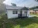 Charming single-story home featuring a covered porch and newly painted exterior at 18127 Us Highway 41, Spring Hill, FL 34610