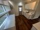 Bright kitchen with white cabinetry, quartz countertops, and updated appliances at 18127 Us Highway 41, Spring Hill, FL 34610