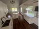 Beautiful kitchen with white cabinets, stainless steel appliances, and hardwood floors at 18127 Us Highway 41, Spring Hill, FL 34610