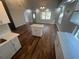 Beautiful kitchen featuring an island, white cabinets, and modern recessed lighting at 18127 Us Highway 41, Spring Hill, FL 34610