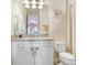 Bathroom showcasing a vanity with granite counters, complemented by neutral walls and fixtures at 18824 Birchwood Groves Dr, Lutz, FL 33558
