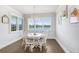 Cozy dining room with views of the lake from the windows at 18824 Birchwood Groves Dr, Lutz, FL 33558