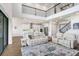 Spacious living room features high ceilings, an open floor plan, and seamless access to the kitchen at 18824 Birchwood Groves Dr, Lutz, FL 33558