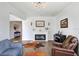 Inviting living room featuring a fireplace, piano, and comfortable seating at 18824 Birchwood Groves Dr, Lutz, FL 33558