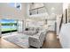 Spacious living room features high ceilings, an open floor plan, and seamless access to the kitchen at 18824 Birchwood Groves Dr, Lutz, FL 33558