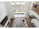 Open floor plan living room with high ceilings, a ceiling fan, and large windows at 18824 Birchwood Groves Dr, Lutz, FL 33558
