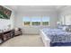 Spacious main bedroom features three large bright windows with views of the lake at 18824 Birchwood Groves Dr, Lutz, FL 33558