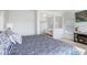 Main bedroom featuring sitting room and bright windows overlooking the lake at 18824 Birchwood Groves Dr, Lutz, FL 33558