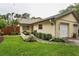 Charming single Gathering home with manicured landscaping and a one car garage at 1948 Elaine Dr, Clearwater, FL 33760